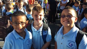 Chris and two of his best buddies starting 3rd grade in 2013. One thing he's looking forward to this year: not wearing a uniform.
